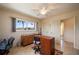 Bedroom features a ceiling fan, dresser, and tile flooring at 805 Brenda Ct, Punta Gorda, FL 33950