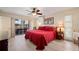Bedroom with ceiling fan and access to the lanai at 805 Brenda Ct, Punta Gorda, FL 33950