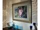 Stylish home decor featuring a flamingo art print, glass art, and decorative candles enhancing the ambiance of the living space at 805 Brenda Ct, Punta Gorda, FL 33950