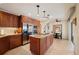 Modern kitchen boasts stainless appliances, granite countertops, and a large center island at 805 Brenda Ct, Punta Gorda, FL 33950