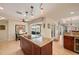 Open kitchen with granite island, stainless appliances, and a view to the pool at 805 Brenda Ct, Punta Gorda, FL 33950