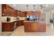 Beautiful kitchen with wooden cabinetry, stainless appliances, and an island at 805 Brenda Ct, Punta Gorda, FL 33950