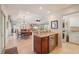Open-concept kitchenette with beverage cooler, connecting the living area to laundry at 805 Brenda Ct, Punta Gorda, FL 33950