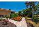 Well-manicured landscaping with beautiful plants and walkway to the house at 805 Brenda Ct, Punta Gorda, FL 33950