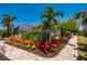 Exterior view showcasing vibrant landscaping and well-maintained gardens enhancing the curb appeal of this lovely home at 805 Brenda Ct, Punta Gorda, FL 33950
