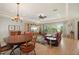 Open-concept living area with plenty of light, tiled flooring and ceiling fan at 805 Brenda Ct, Punta Gorda, FL 33950