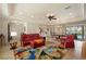 Well-lit living room with open floor plan flowing into dining area and kitchen at 805 Brenda Ct, Punta Gorda, FL 33950