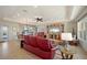 Bright living room features recessed lighting, tray ceiling and open layout at 805 Brenda Ct, Punta Gorda, FL 33950