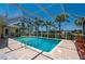 Gorgeous pool with lanai and lush tropical landscaping around canal at 805 Brenda Ct, Punta Gorda, FL 33950