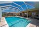 Relaxing screened pool and patio area with hot tub and grille at 805 Brenda Ct, Punta Gorda, FL 33950