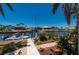Scenic waterfront view with a boat dock, lush landscaping, and charming homes, showcasing a serene coastal lifestyle at 805 Brenda Ct, Punta Gorda, FL 33950