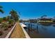 Canal front property with a private boat dock and lift, offering easy access to the water for boating and recreation at 805 Brenda Ct, Punta Gorda, FL 33950