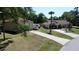 Long driveway leading to a home with an oversized outbuilding and RV parking at 14057 Maxwell Ave, Port Charlotte, FL 33953