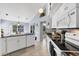 Modern kitchen featuring granite countertops, stainless appliances, and an island at 14057 Maxwell Ave, Port Charlotte, FL 33953