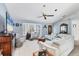 Bright living room with large windows, plush seating, and a welcoming atmosphere at 14057 Maxwell Ave, Port Charlotte, FL 33953
