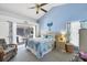 Spacious main bedroom features a queen bed, vaulted ceiling, and a slider to the pool at 14057 Maxwell Ave, Port Charlotte, FL 33953
