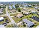 Residential single Gathering neighborhood with waterfront homes, canals, boat docks, palm trees, and mature landscaping at 148 Salem Nw Ave, Port Charlotte, FL 33952