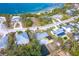 An aerial view shows the property's proximity to the bay and highlights its waterfront location and neighborhood at 201 Winson Ave, Englewood, FL 34223