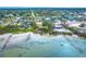 A beachfront aerial view highlights the property's convenient access to both the beach and the community at 201 Winson Ave, Englewood, FL 34223