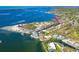 An aerial view showcases a property near the water with beautiful coastal scenery and nearby amenities at 201 Winson Ave, Englewood, FL 34223