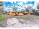 Exterior view of home and yard, with landscaping at 201 Winson Ave, Englewood, FL 34223