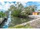 A waterfront property features a private boat dock and canal access, great for boating enthusiasts at 201 Winson Ave, Englewood, FL 34223
