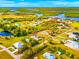 A beautiful home is outlined in red and offers easy access to the dock and river at 500 Woodstork Ln, Punta Gorda, FL 33982