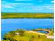 Aerial view showcases waterfront property with a tranquil lagoon with abundant natural beauty at 500 Woodstork Ln, Punta Gorda, FL 33982