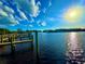 A picturesque dock on tranquil water is ideal for boating, fishing, and enjoying waterfront living at 500 Woodstork Ln, Punta Gorda, FL 33982