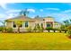Charming home with a well-manicured lawn, beautifully landscaped front yard, and inviting curb appeal at 500 Woodstork Ln, Punta Gorda, FL 33982