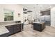 Gourmet kitchen with granite counters, custom cabinets, stainless appliances, and open to living room at 500 Woodstork Ln, Punta Gorda, FL 33982
