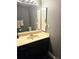 Bathroom with dark vanity, sink and ample vanity storage at 1174 Victoria Ave, Port Charlotte, FL 33948