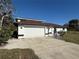 Exterior front of home featuring the garage and driveway at 1438 Navigator Rd, Punta Gorda, FL 33983
