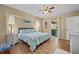 Relaxing bedroom with a slider to the outdoor area, a ceiling fan, and calming decor at 18147 Cadillac Ave, Port Charlotte, FL 33948