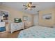 Bedroom with a flat-screen TV, light colored walls, and an attached bathroom at 18147 Cadillac Ave, Port Charlotte, FL 33948