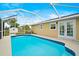 Backyard pool featuring screened-in enclosure and easy access to home, perfect for relaxing and enjoying the outdoors at 3255 Lake View Blvd, Port Charlotte, FL 33948