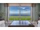 Bright living room featuring a picturesque view of the water and a glass top coffee table at 1 Colony Point Dr # A19, Punta Gorda, FL 33950