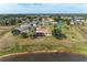 Beautiful home with a screened lanai and lush green surroundings and a pond at 1115 Venture Ct, Punta Gorda, FL 33983