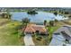 Aerial view of home showing roof, pool and surrounding landscaping at 1115 Venture Ct, Punta Gorda, FL 33983