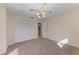Neutral bedroom with double closet and doorway to the bathroom at 1115 Venture Ct, Punta Gorda, FL 33983