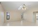 Large bedroom features tile flooring, large windows, and ceiling fan at 1115 Venture Ct, Punta Gorda, FL 33983