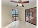 Bedroom with tiled floors and access to pool and lanai at 1115 Venture Ct, Punta Gorda, FL 33983