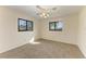 Bedroom featuring neutral carpeting and two windows providing natural light at 1115 Venture Ct, Punta Gorda, FL 33983