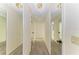 Hallway featuring neutral paint, carpet and mirrored closet doors at 1115 Venture Ct, Punta Gorda, FL 33983