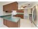 Kitchen with stainless steel appliances, wood cabinets, and sink at 1115 Venture Ct, Punta Gorda, FL 33983