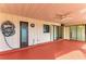 Covered lanai featuring a fan, hose, and sliding door access to inside at 1115 Venture Ct, Punta Gorda, FL 33983