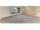 Comfortable living space featuring neutral carpet and a large picture window with a neighborhood view at 1115 Venture Ct, Punta Gorda, FL 33983