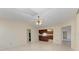 Spacious living room with light-colored tile flooring and ceiling fan at 1115 Venture Ct, Punta Gorda, FL 33983