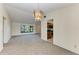 Open living space showcasing a view of the surrounding neighborhood and an adjacent galley kitchen at 1115 Venture Ct, Punta Gorda, FL 33983