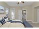 Bedroom featuring neutral walls, carpeted floor, and a view of the living room, all in a cozy design at 240 W End Dr # 412, Punta Gorda, FL 33950